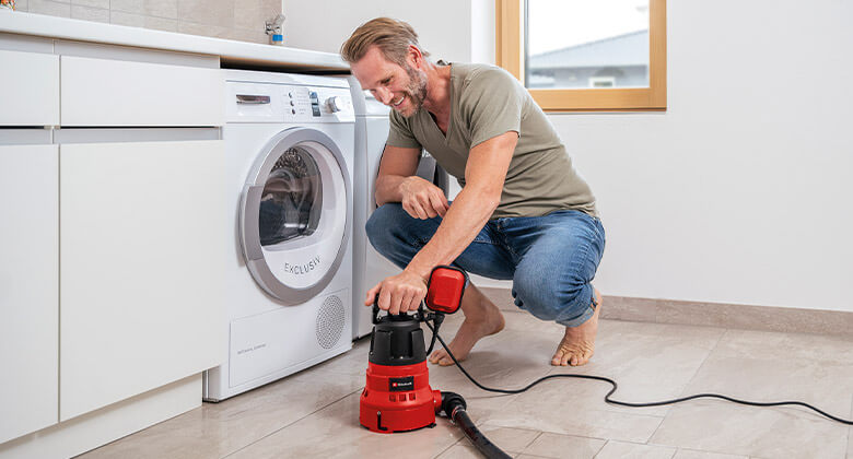 man with a submersible pump