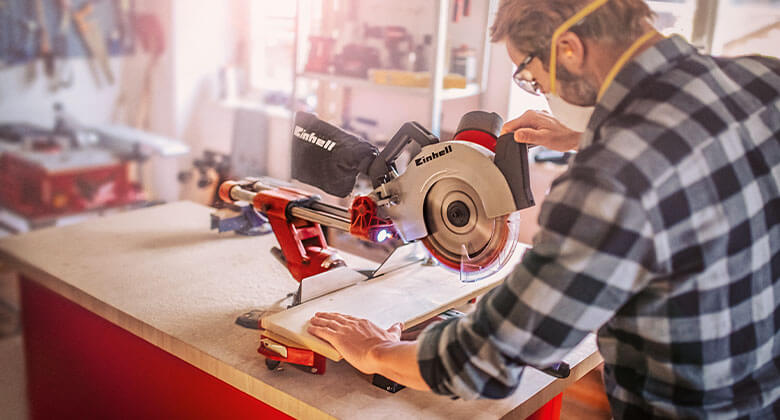 man using a mitre saw