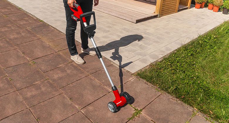 cordless grout cleaner in use